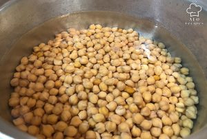 Put the chickpeas in a pot of water on the heat