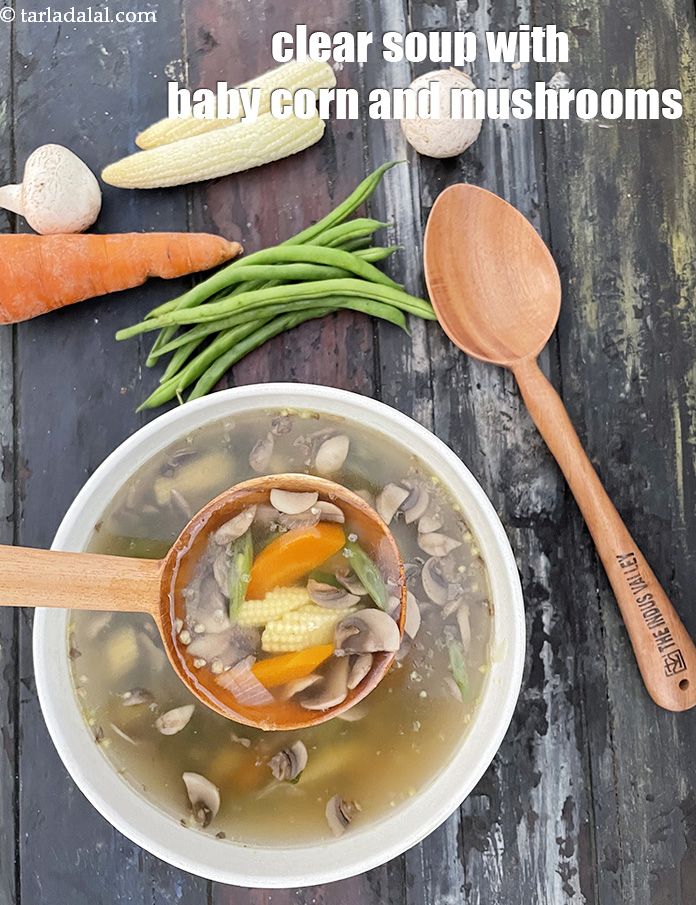 Clear soup with babycorn mushrooms and carrot